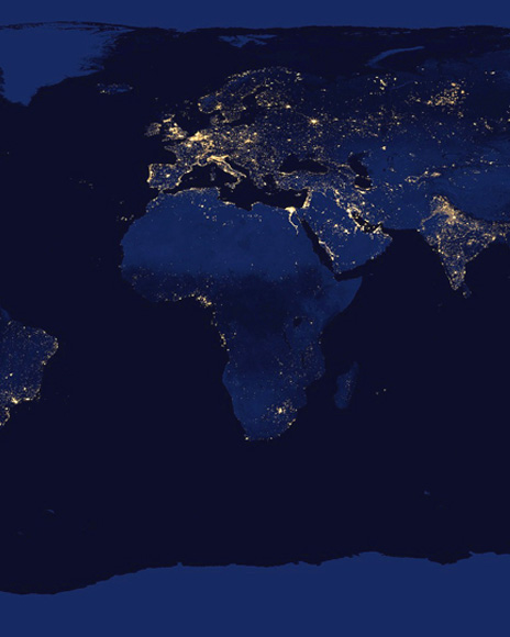 A dark world map showing the world with lights, focusing on Europe and Africa.